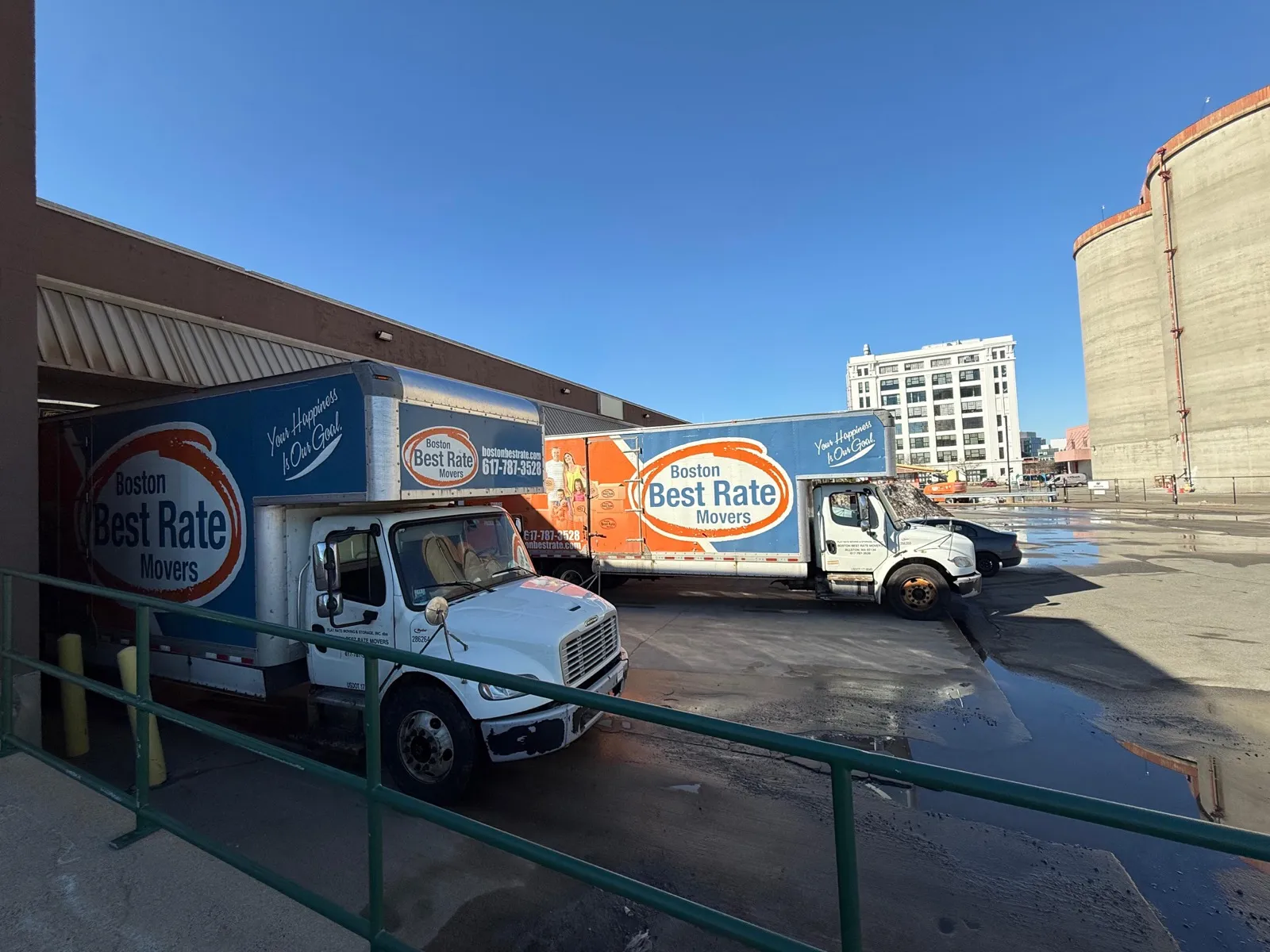 Two BBRM branded trucks parked side by side