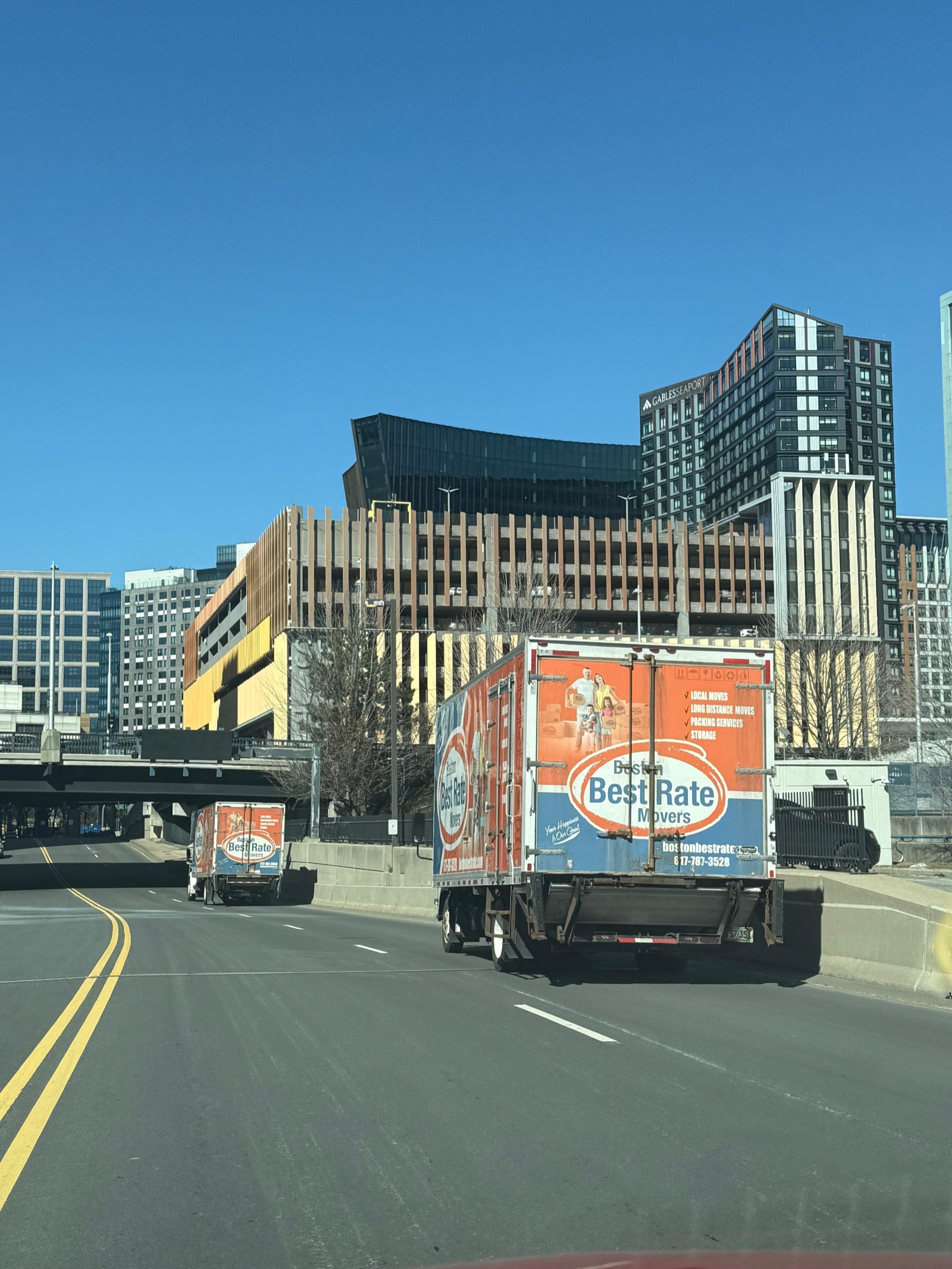 Boston Best Rate Movers trucks driving on Boston highway