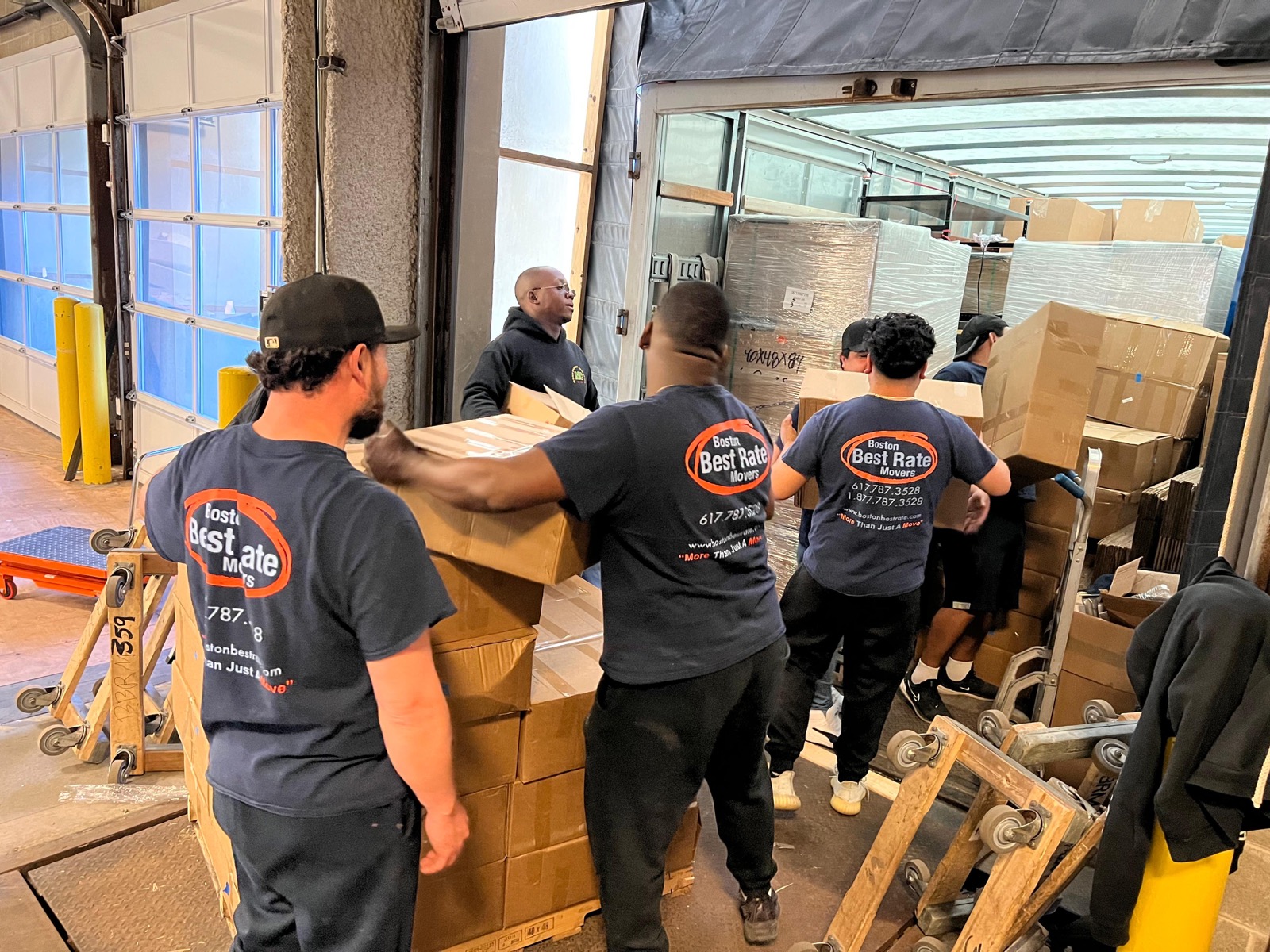 Full BBRM crew coordinating box loading at commercial loading dock