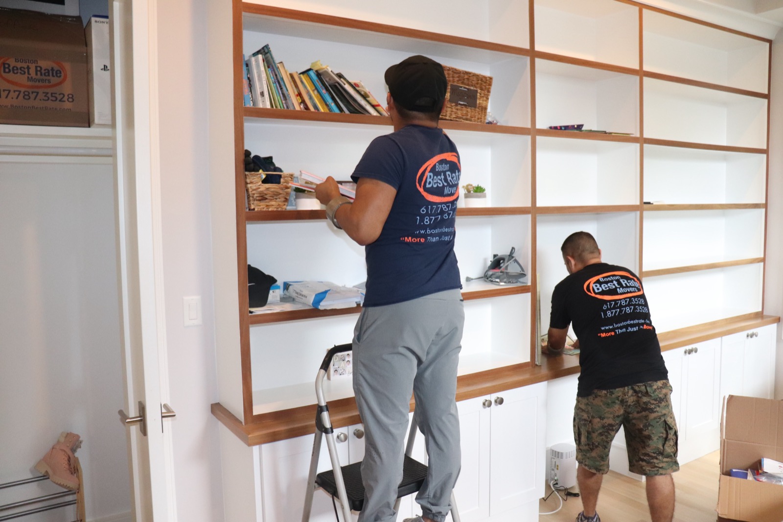 BBRM crew member organizing office shelving during a move