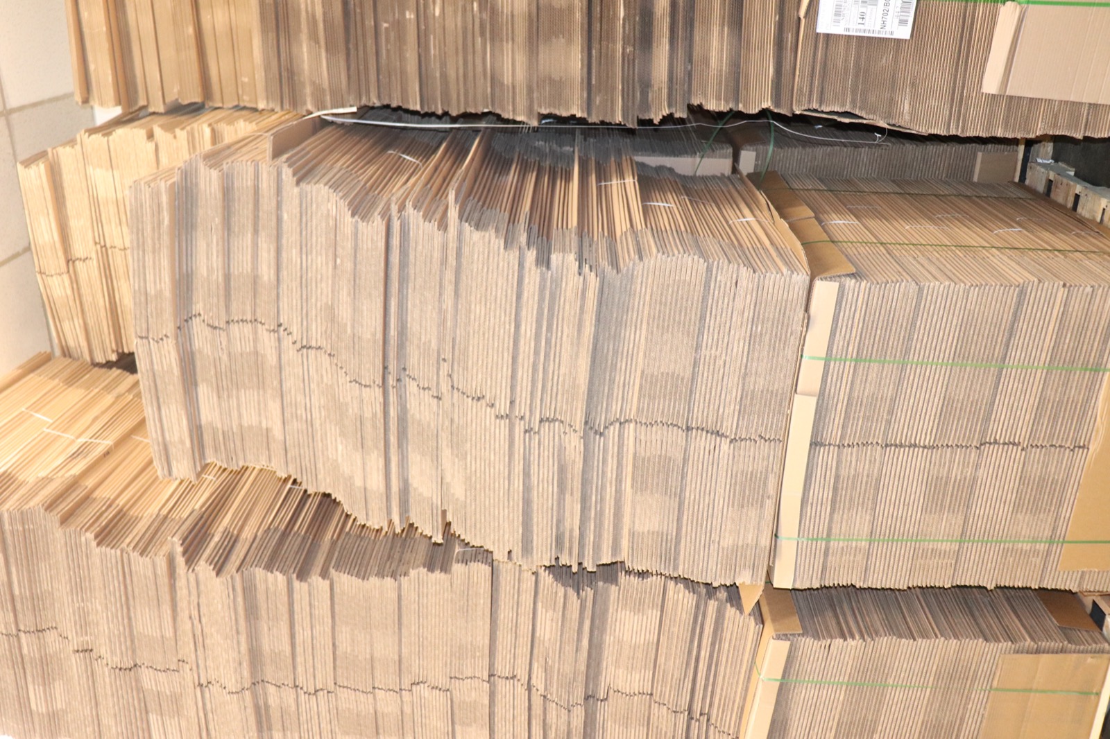 Flat moving boxes stacked in storage