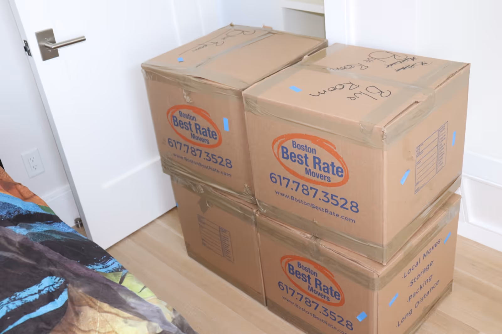Boston Best Rate Movers boxes neatly packed in bedroom during a move