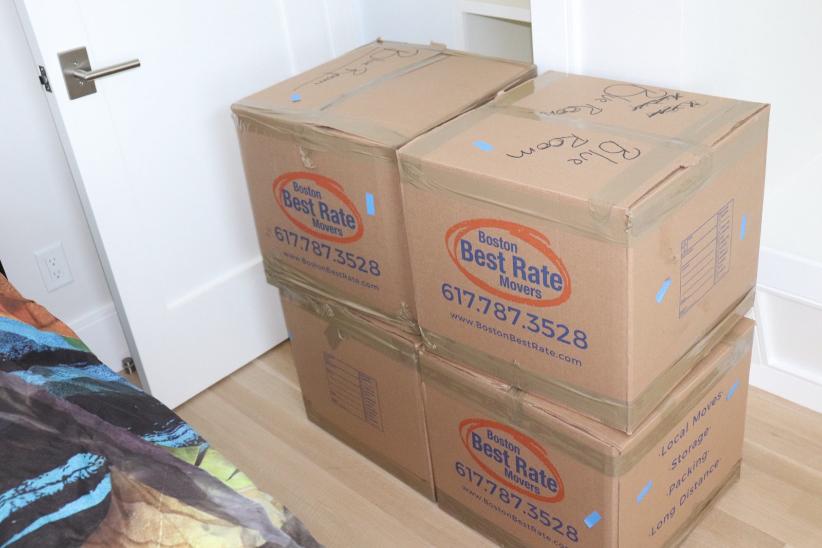 Boston Best Rate Movers boxes neatly packed in bedroom during a move