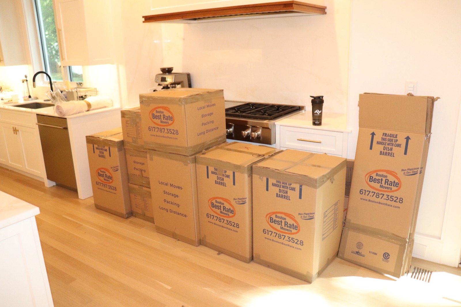 BBRM branded moving boxes packed in a kitchen
