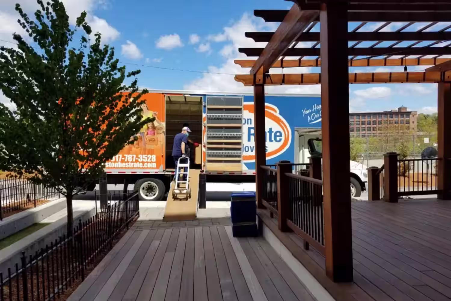 Boston movers wrapping furniture — Boston Best Rate Movers crew protecting items before loading