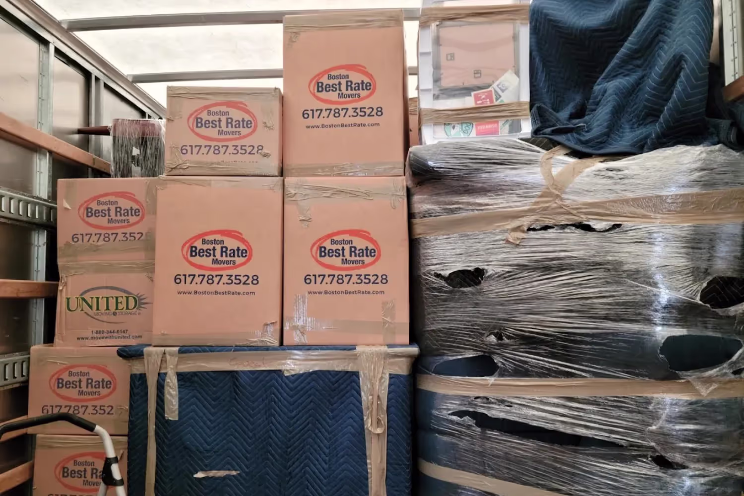Boston movers — wrapped and padded furniture loaded for safe transport