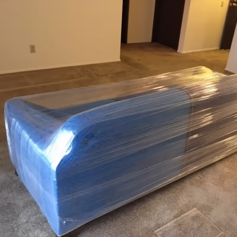 BBRM crew wrapping and moving furniture