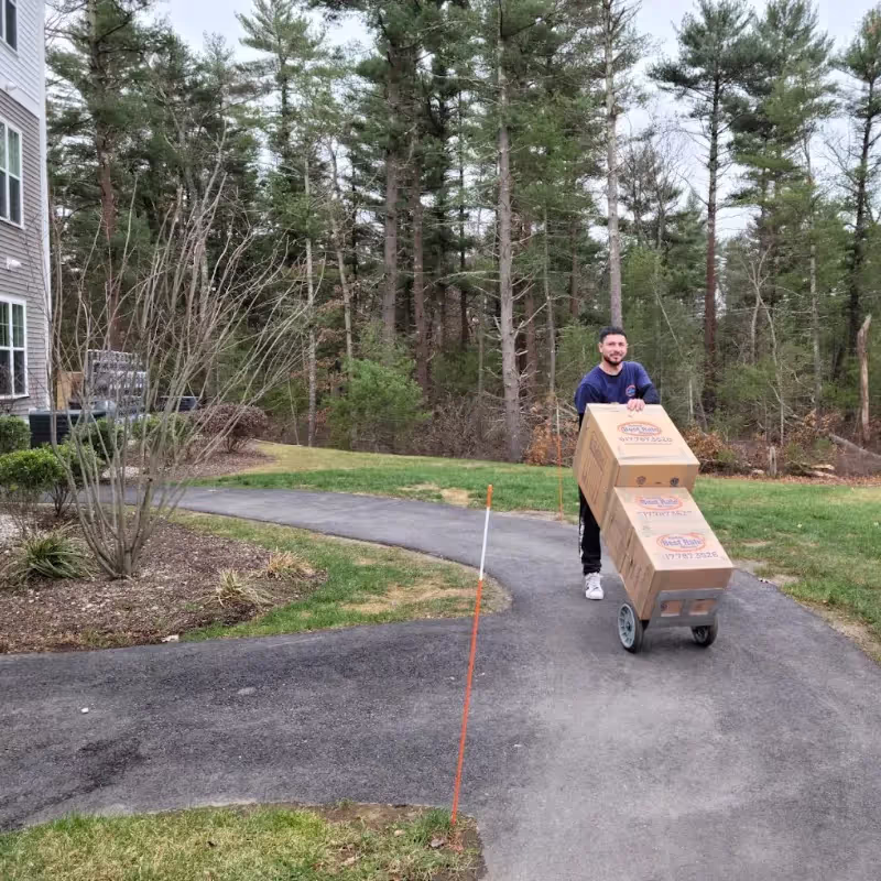 Boston Best Rate Movers team unloading at destination