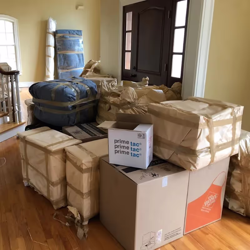 Boston Best Rate Movers securing items on a moving dolly