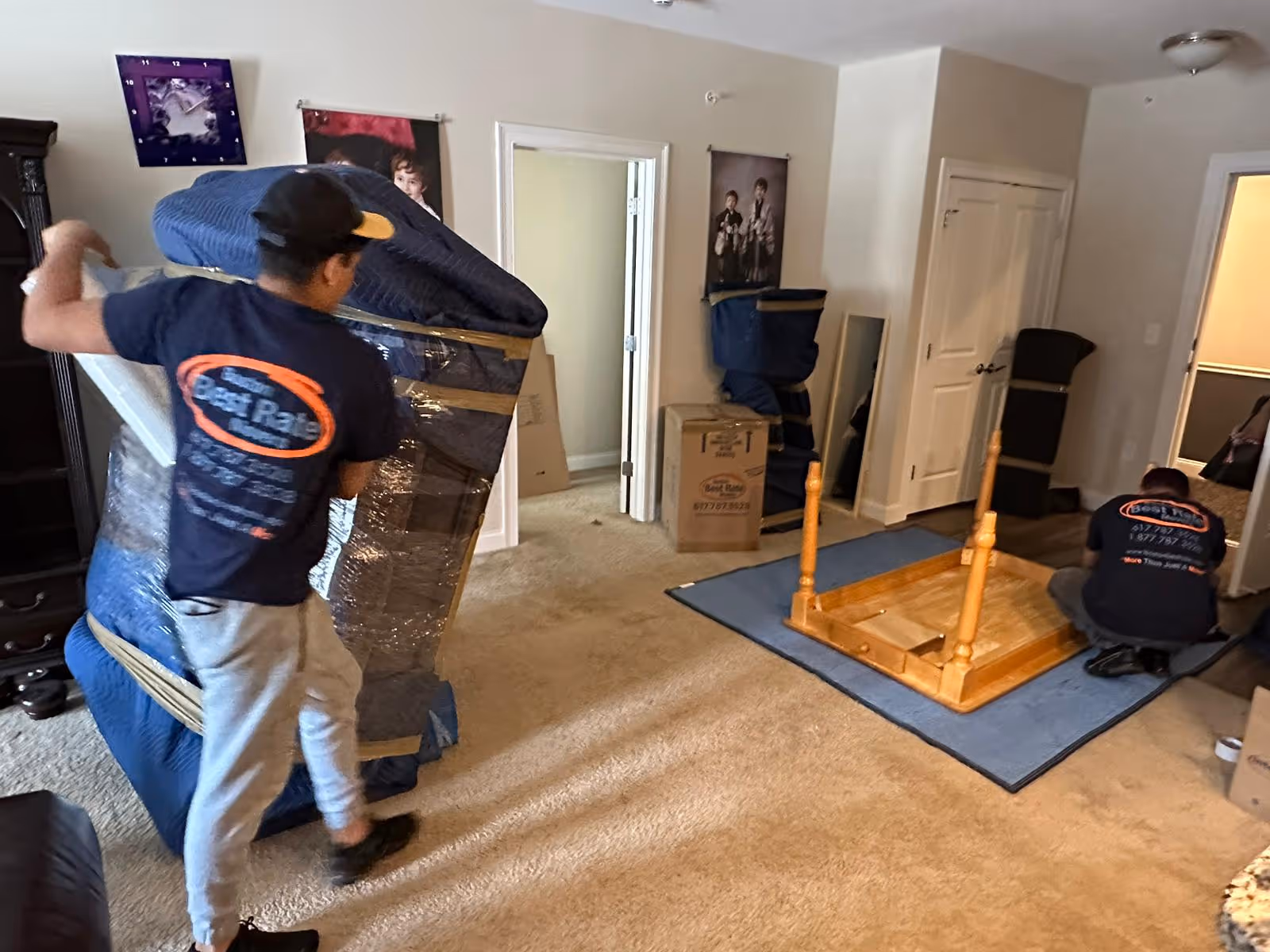 Boston Best Rate Movers crew member carrying furniture during a move