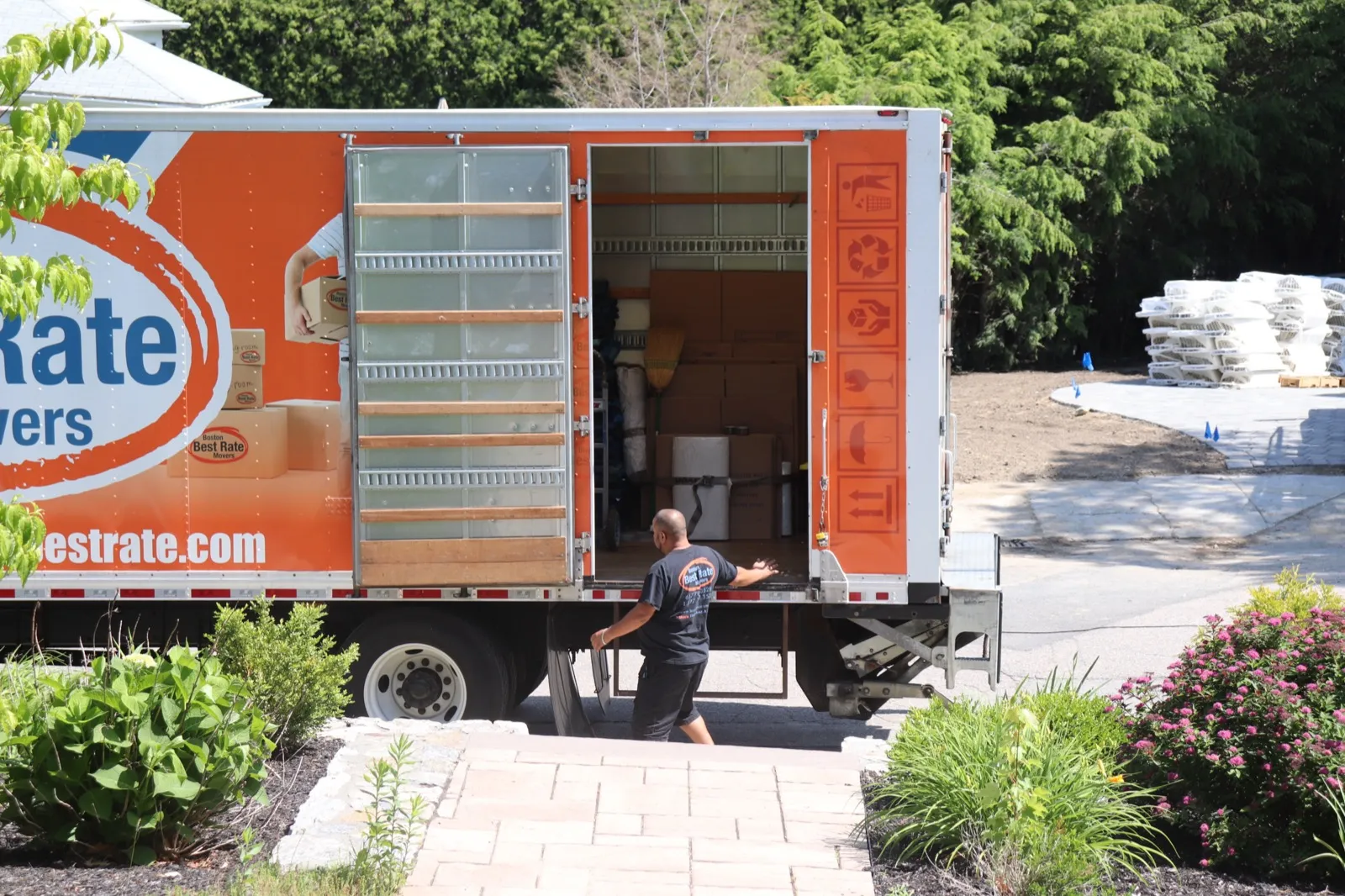 Boston Best Rate Movers crew loading items into packed moving truck