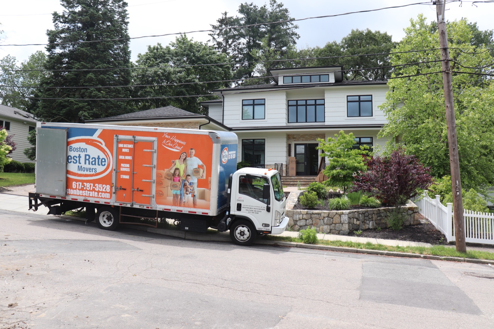 Boston Best Rate Movers truck at a residential home move